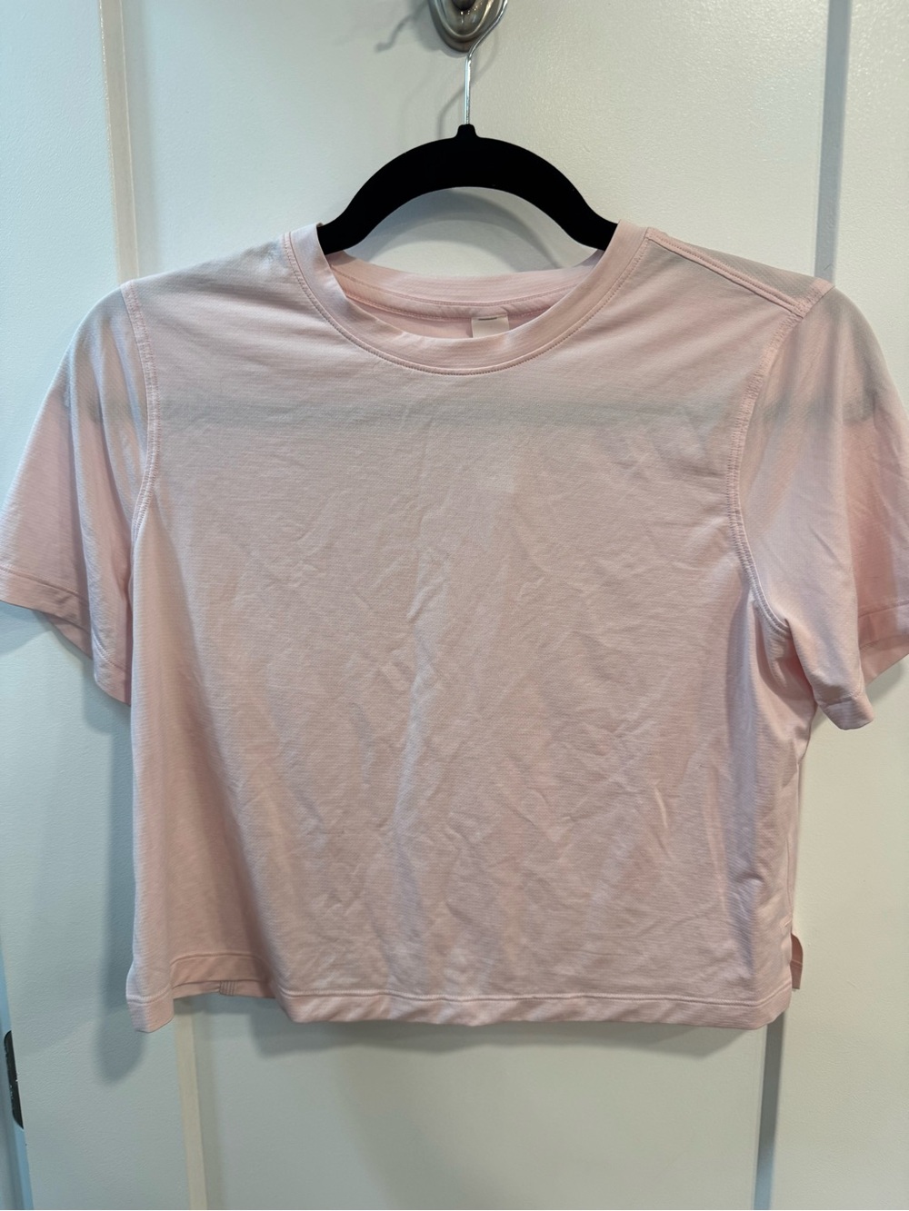 Lululemon Athletica Ultralight Waistlength Crop Tee in a light pink color size 6